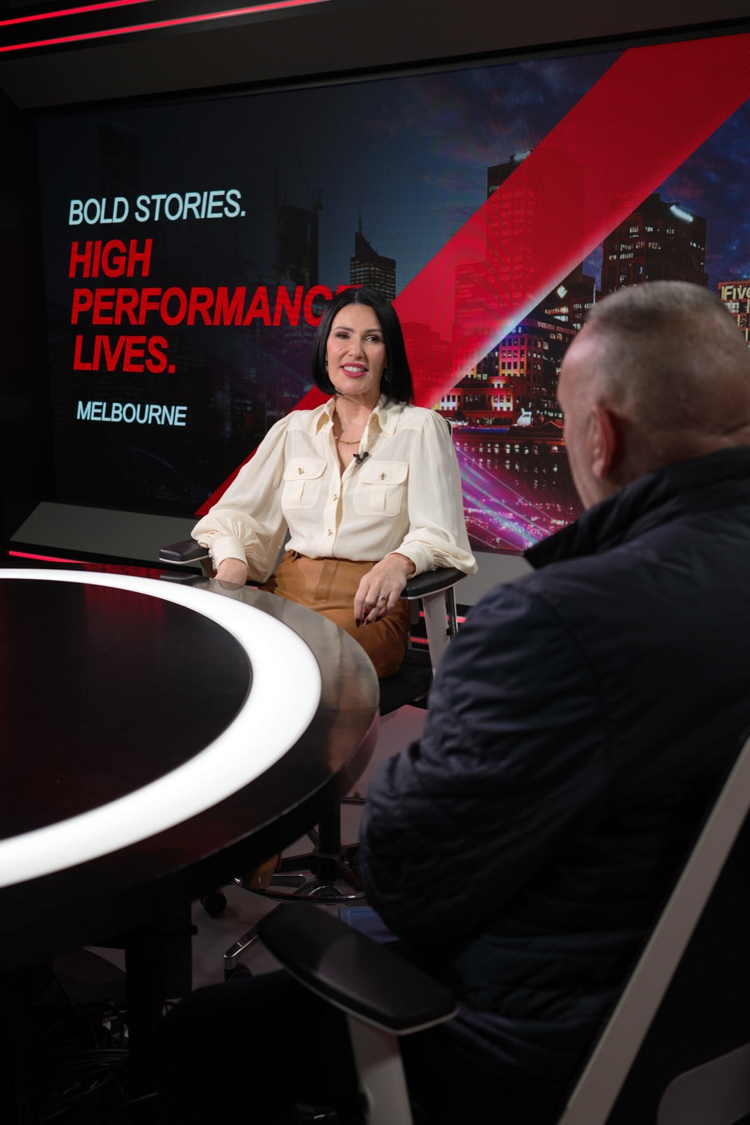 Penny Lane interviewing a guest on In the Driver's Seat
